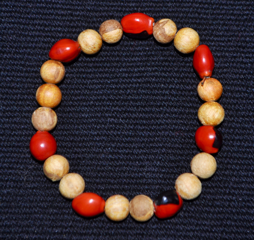 Armband aus Perlen von Palo Santo und Wayruro